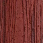 Close-up of a reddish-brown wood surface with vertical dark grain lines and natural texture patterns.