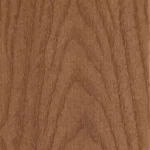 Close-up of a wooden surface with a natural brown color and visible grain patterns forming a symmetrical, V-shaped design. The texture appears smooth and polished.