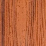 Close-up of a wooden surface with a reddish-brown tone and visible dark vertical grain patterns running throughout.
