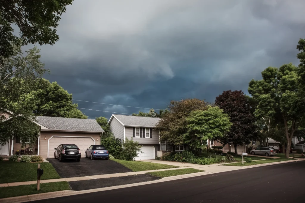 storm clouds gathering before causing damage to a roof