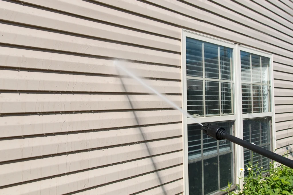 spraying siding