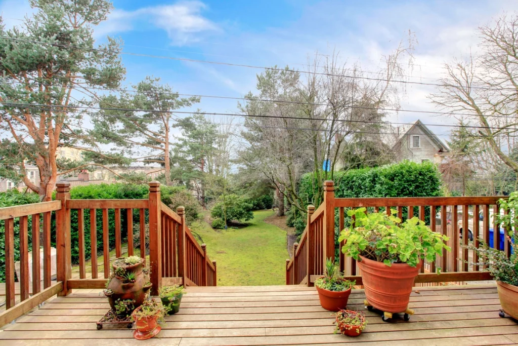wood deck with plants potted on the floor