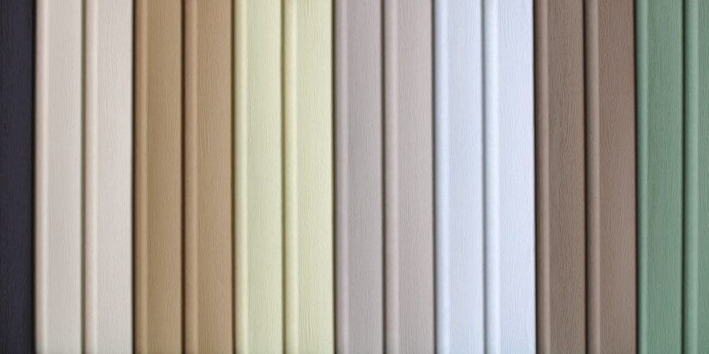 Vertical rows of wood panels in various colors, including grey, beige, yellow, white, and green. The panels are evenly aligned, creating a uniform pattern. The surface texture of the panels is subtly visible.
