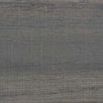 Close-up of a textured gray surface with intersecting horizontal and vertical lines, creating a woven or fabric-like appearance. The shades of gray vary subtly across the surface.