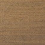 Close-up of a brown wooden surface with a textured, grainy pattern running horizontally across the image. The wood appears smooth but has visible lines and natural variations in color.