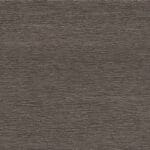 Close-up of a textured brown surface with horizontal lines and subtle ridges, resembling wood grain or rough fabric.