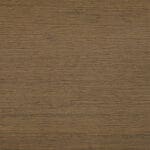 Close-up of a brown wooden surface with a visible horizontal grain pattern, giving a natural texture and earthy appearance.