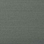 Close-up of a textured surface painted in a muted green color, with horizontal lines resembling wood grain or a rough outdoor wall finish.