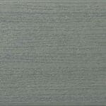 Close-up of a textured surface painted in muted green. The surface has horizontal ridges and grooves, resembling wood grain or fibrous material.