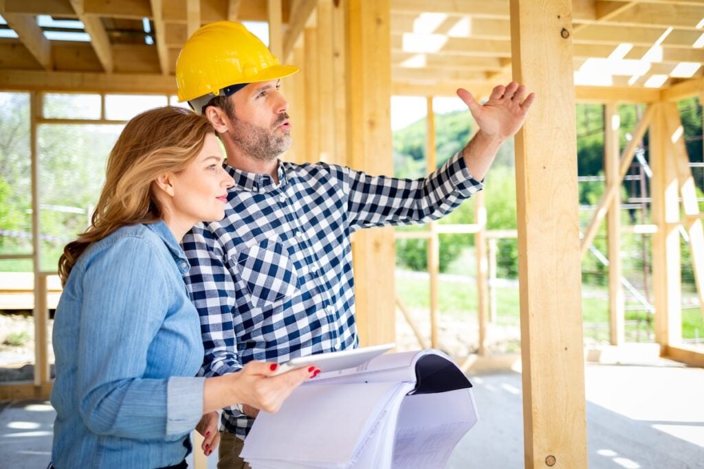 A contractor and homeowners discussing a project