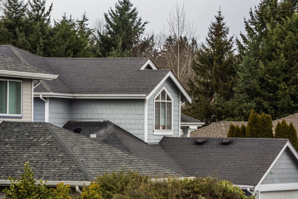 gray, shingle-roofed suburban house