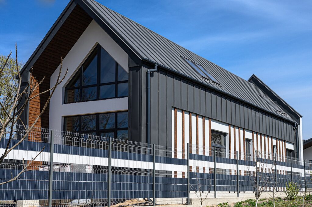 Gray private house with metal tile.enhances its contemporary appeal.