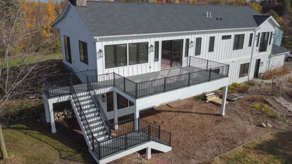 A modern white house with a spacious elevated deck