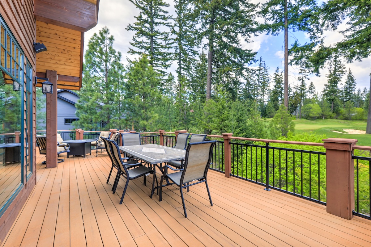 Spacious wooden deck with a dining table and chairs