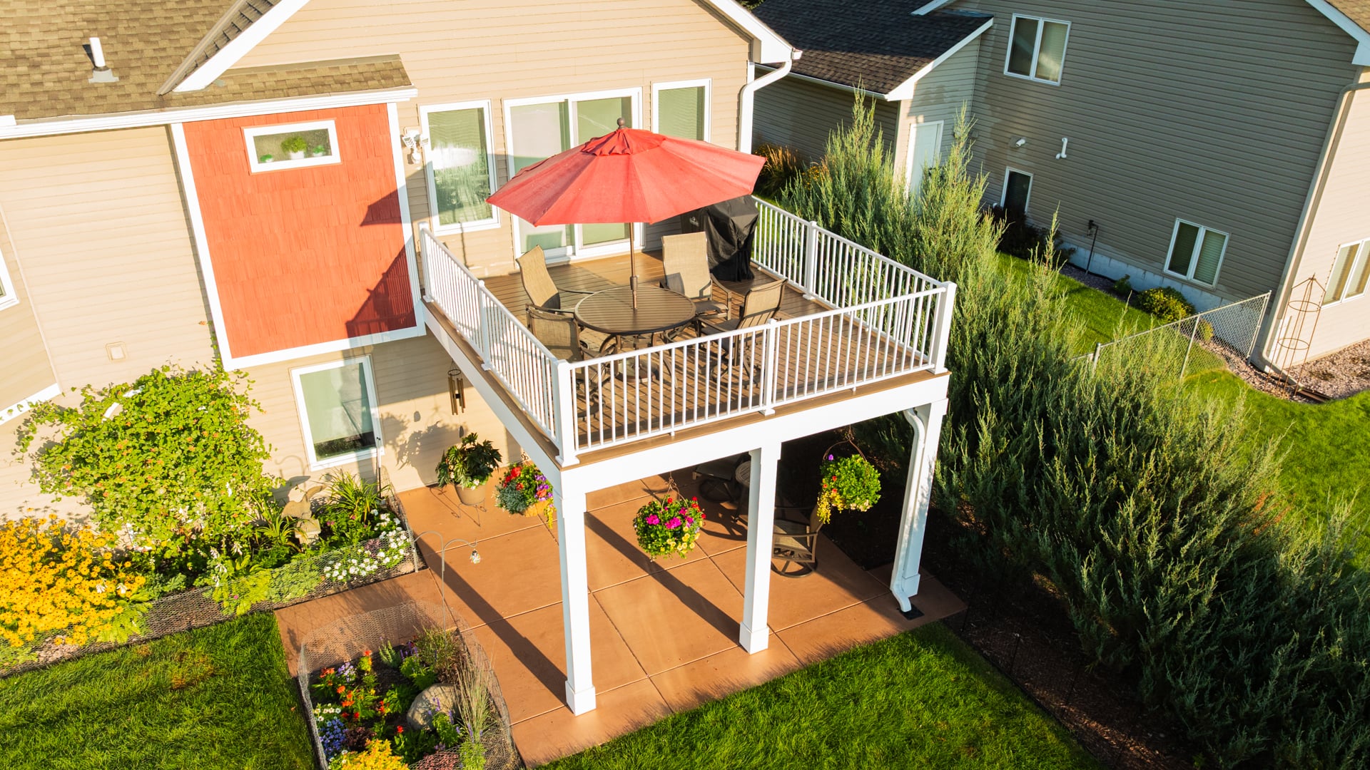 Deck installation in Lino Lakes with TimberTech deck with antique leather color and white Westbury railing.