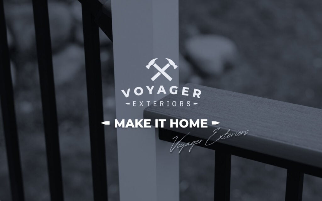 A close-up of a deck railing, perfect for composite railing ideas, with the "Voyager Exteriors" logo featuring crossed hammers and the slogan "Make It Home" overlaid in white text.